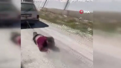 Köpeğine zarar veren adamı otomobile bağlayıp sürükledi