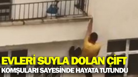 Evleri suyla dolan çift komşularının uzattığı ip yardımıyla hayata tutundu