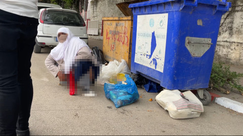 Dilenci kadın, zabıtadan kurtulmak için caddeye tuvaletini yaptı
